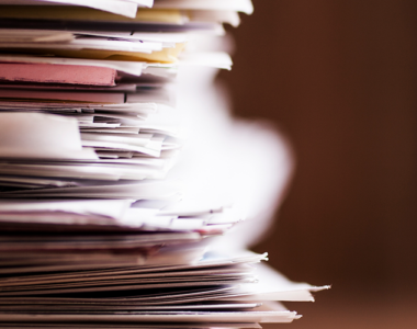 stacks of income and expense documents