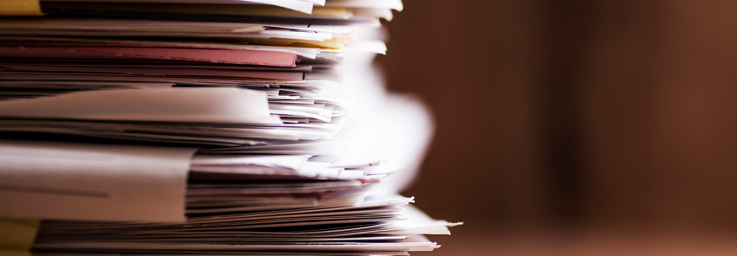 stacks of income and expense documents