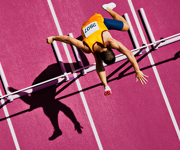 jumping over hurdles and running through challenges