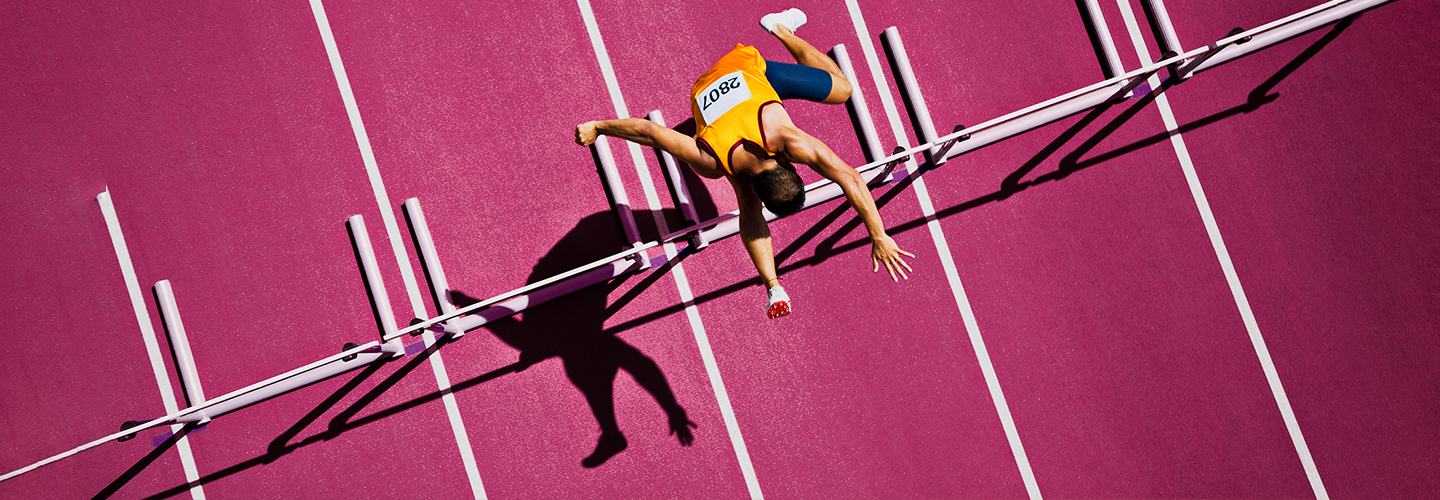 jumping over hurdles and running through challenges