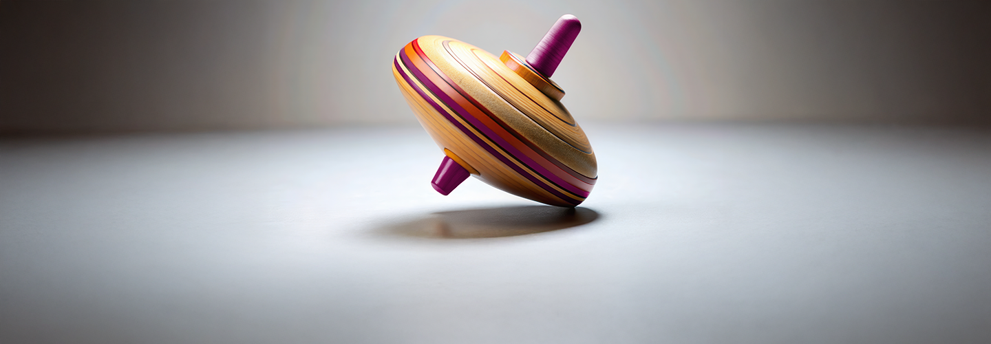 Image of a colourful spinning top tilting off balance, symbolizing market volatility and wobbly financial conditions